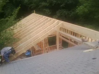 Framing a new roof addition that ties into an existing shingle roof in Waleska